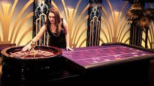 Live dealer studio with professional host managing roulette wheel and cards